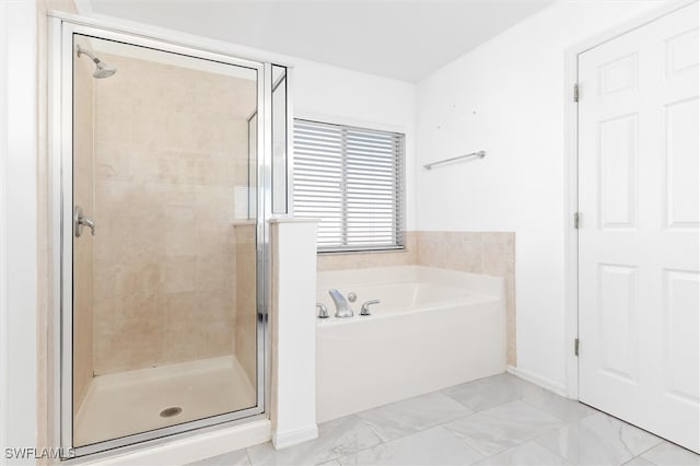 bathroom with separate shower and tub