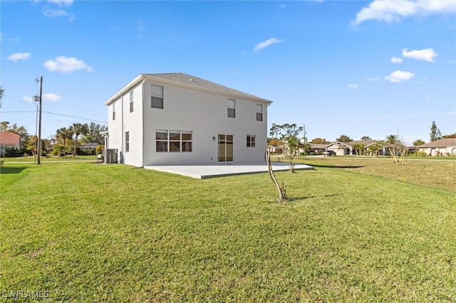 rear view of property with a patio, central AC unit, and a lawn