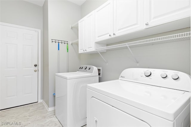 laundry area featuring cabinets and independent washer and dryer