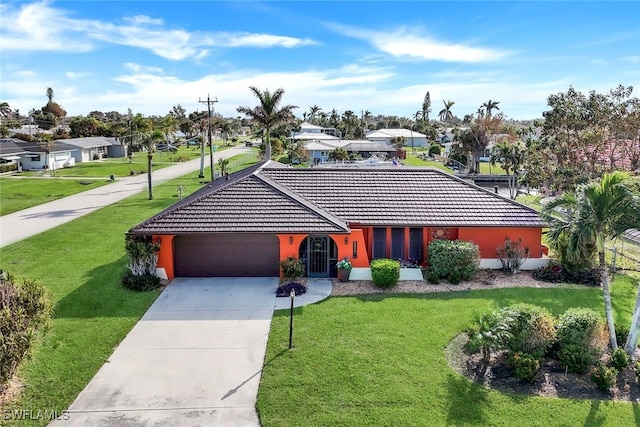 single story home with a front yard and a garage