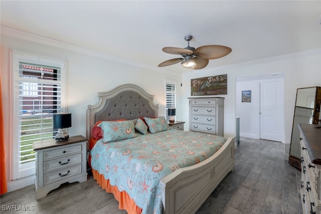 bedroom featuring ceiling fan, dark hardwood / wood-style floors, and ornamental molding