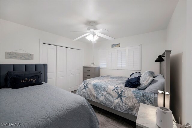 bedroom with ceiling fan and a closet