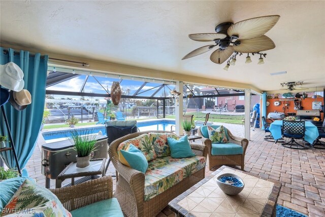 view of patio / terrace featuring outdoor lounge area and glass enclosure