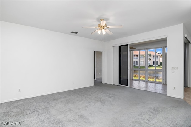 carpeted empty room with ceiling fan