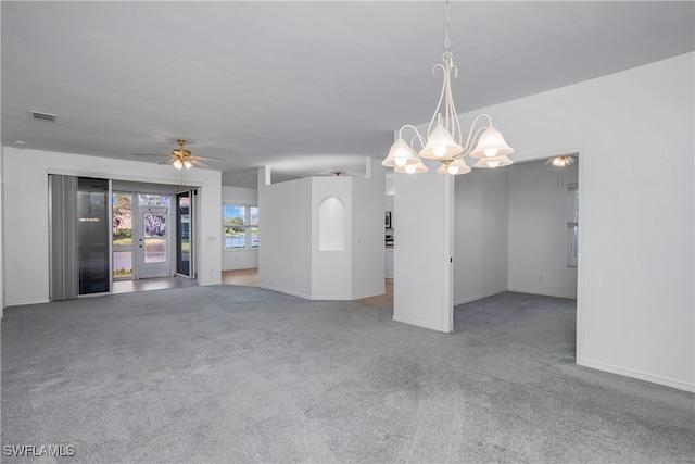 unfurnished room with carpet, ceiling fan with notable chandelier, and french doors