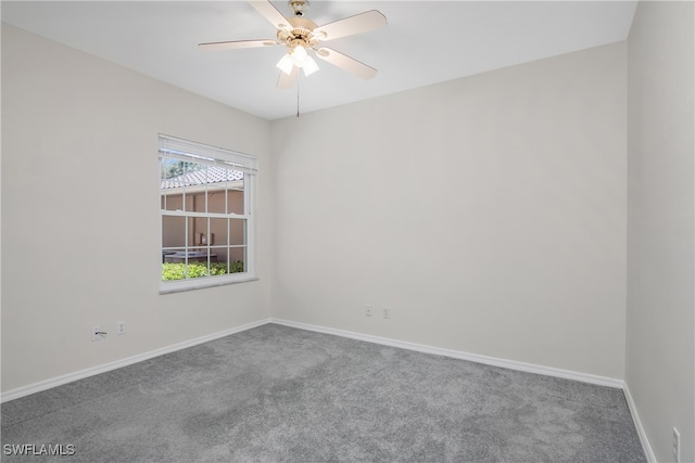 carpeted empty room featuring ceiling fan