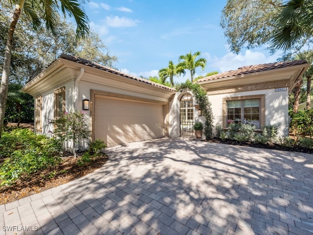 mediterranean / spanish-style home featuring a garage