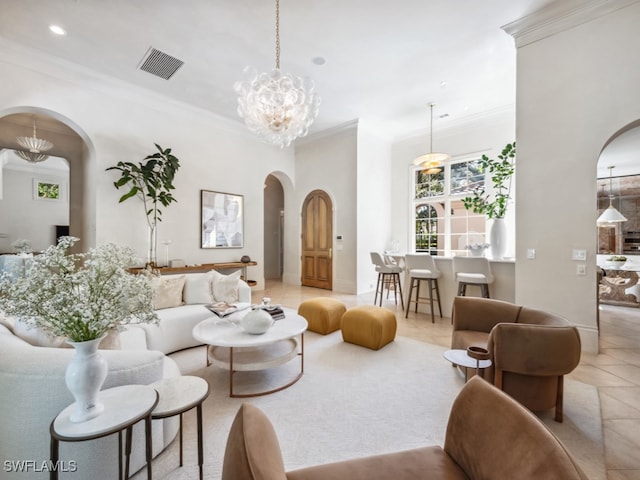 tiled living room with ornamental molding and a notable chandelier