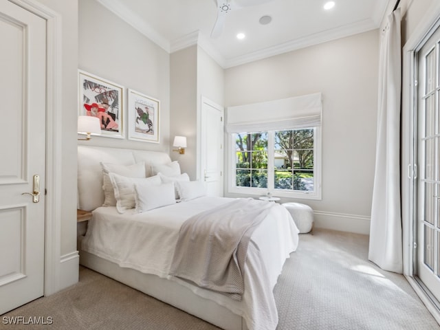 bedroom featuring ornamental molding, light colored carpet, and ceiling fan