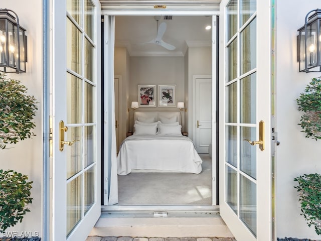 interior space with french doors, ceiling fan, and ornamental molding