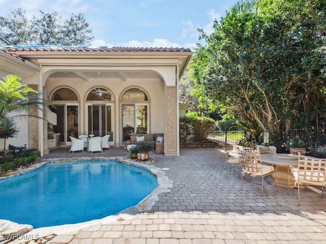 view of swimming pool with a patio