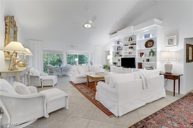 tiled living room with lofted ceiling