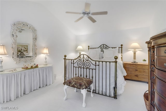 bedroom with light carpet, lofted ceiling, and ceiling fan