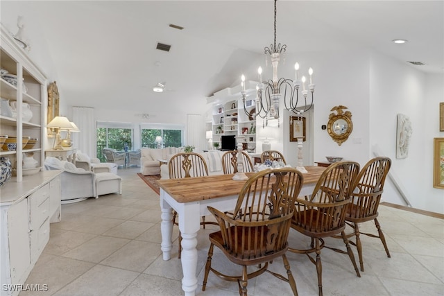 dining space featuring visible vents, an inviting chandelier, light tile patterned floors, and high vaulted ceiling
