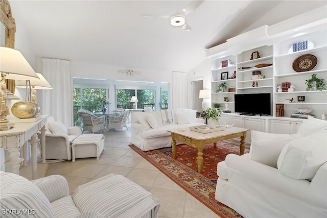 living room featuring lofted ceiling, ceiling fan, and light tile patterned floors