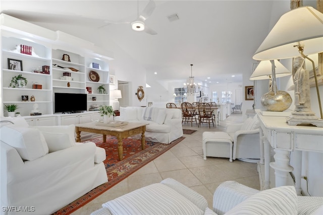 living room featuring vaulted ceiling, ceiling fan with notable chandelier, and light tile patterned floors