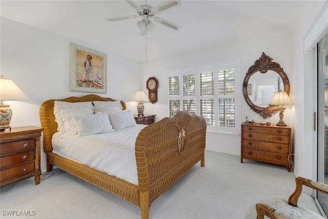 bedroom with ceiling fan and light carpet