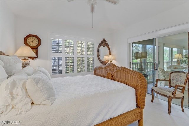 bedroom with multiple windows, carpet floors, a ceiling fan, and access to outside