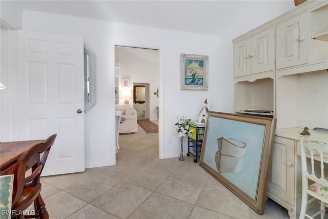 interior space featuring baseboards