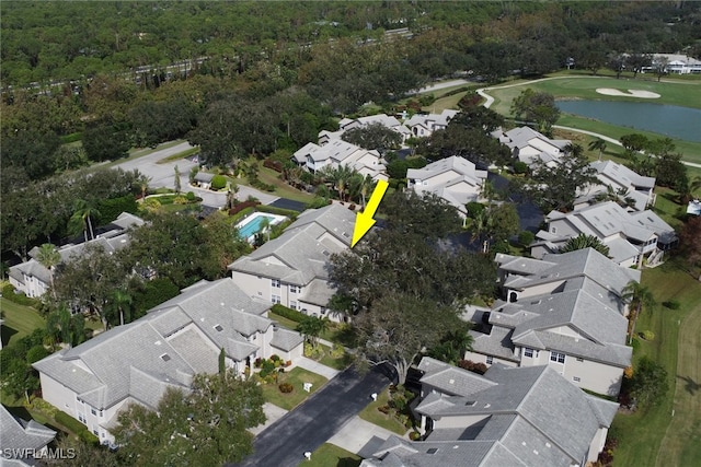 birds eye view of property featuring a wooded view, a residential view, golf course view, and a water view