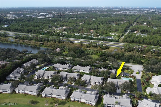 bird's eye view with a residential view and a water view