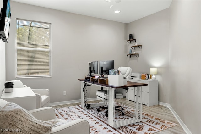 office area featuring ceiling fan and light wood-type flooring