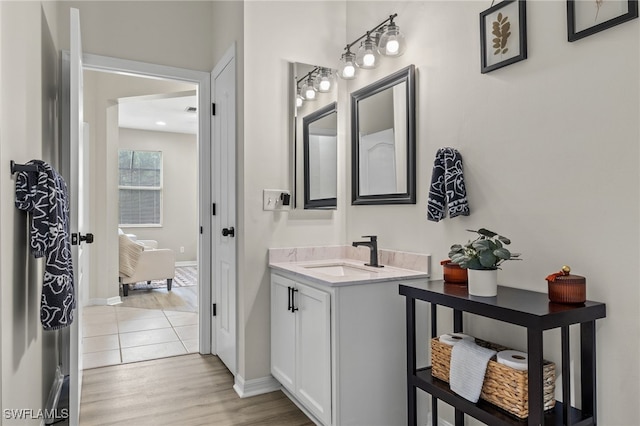 bathroom featuring vanity and hardwood / wood-style flooring