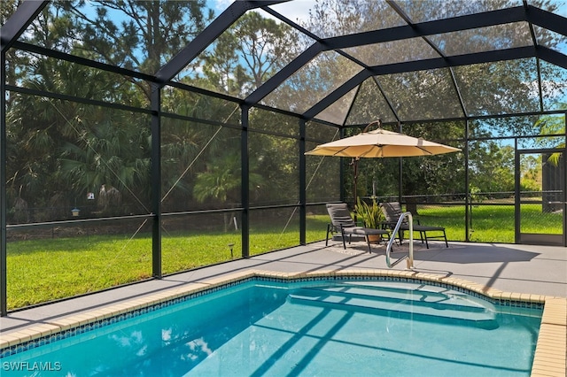 view of swimming pool with a patio area, a lanai, and a lawn