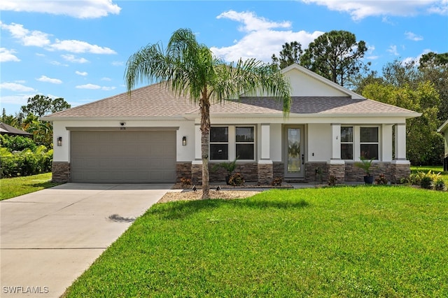 view of front of home featuring a front yard and a garage