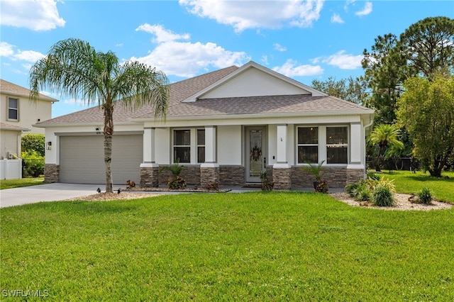 view of front of property featuring a front yard and a garage