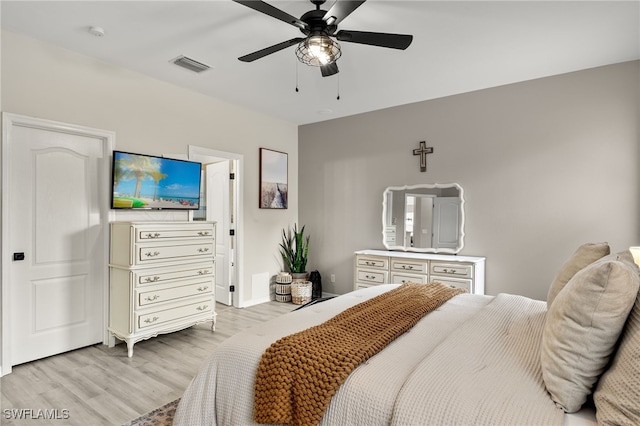 bedroom with light wood-type flooring and ceiling fan