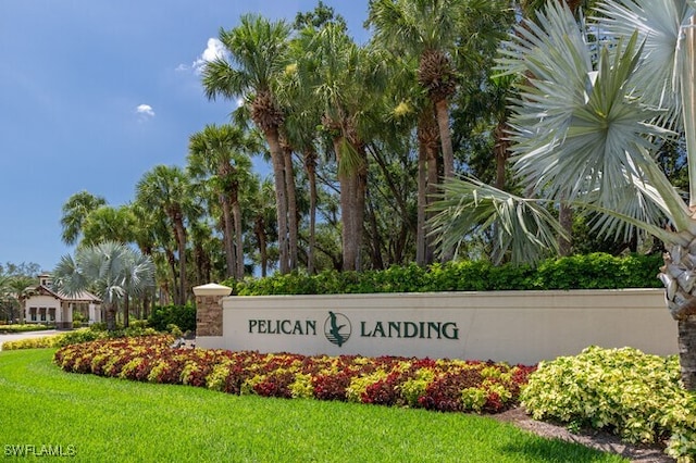 community / neighborhood sign with a lawn