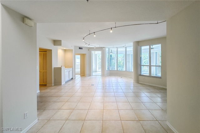 empty room with light tile patterned flooring