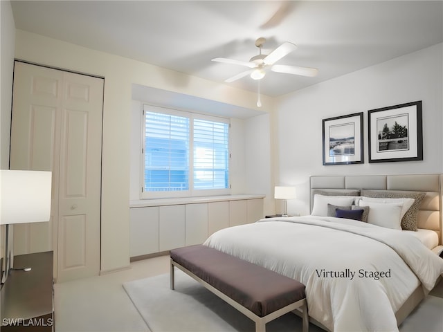 bedroom featuring ceiling fan and carpet