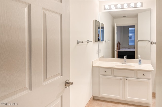 bathroom featuring vanity and tile patterned flooring