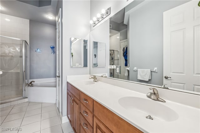 bathroom with vanity, tile patterned floors, and plus walk in shower