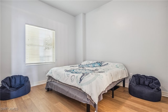 bedroom featuring wood-type flooring