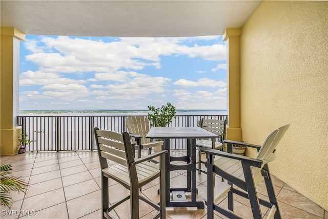 balcony featuring a water view