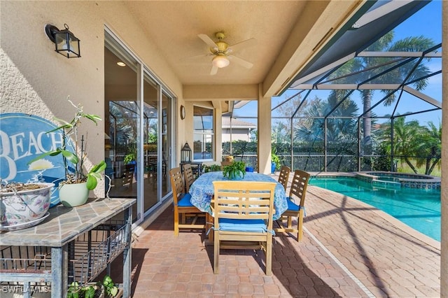 11309 Pond Cypress St, Fort Myers, FL 33913 - view of patio with a pool with connected hot tub, a ceiling fan, glass enclosure, and outdoor dining space