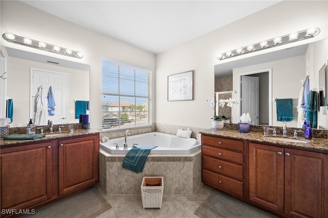 bathroom featuring vanity, plus walk in shower, and tile patterned floors