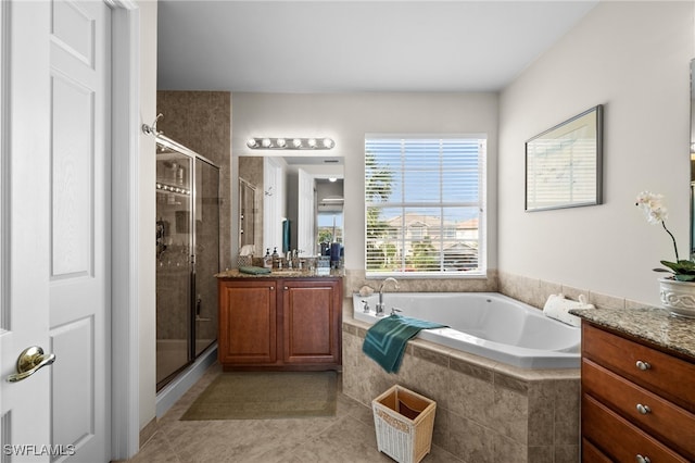 bathroom with vanity, plus walk in shower, and tile patterned floors