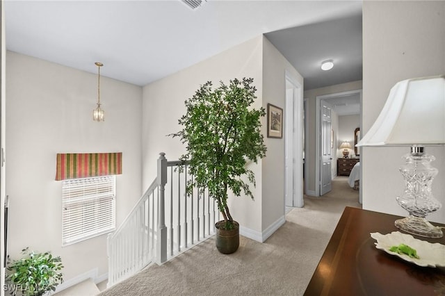 11309 Pond Cypress St, Fort Myers, FL 33913 - hallway featuring an upstairs landing, carpet floors, and baseboards