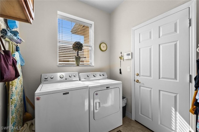 11309 Pond Cypress St, Fort Myers, FL 33913 - laundry room featuring washer and dryer, cabinet space, and light tile patterned flooring