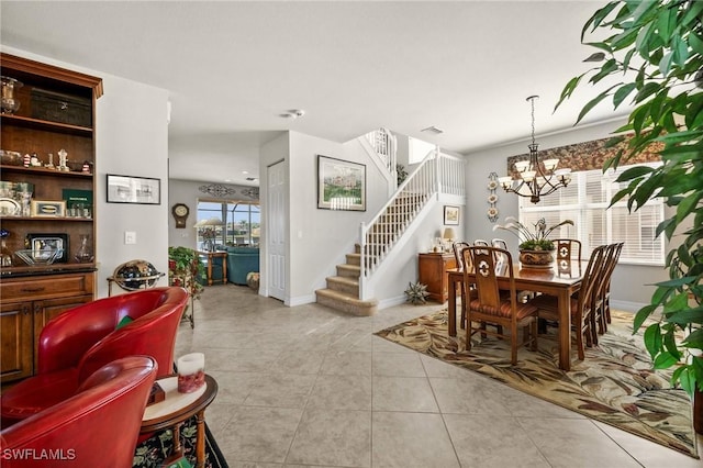 11309 Pond Cypress St, Fort Myers, FL 33913 - dining room featuring stairway, a chandelier, light tile patterned floors, and baseboards
