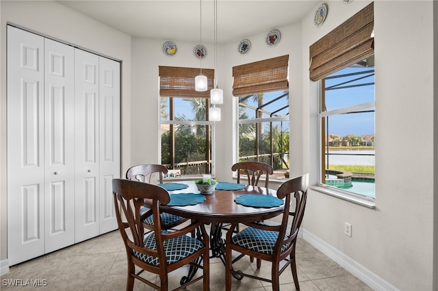 dining space featuring light tile patterned floors