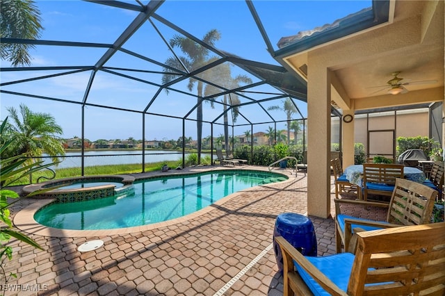 view of swimming pool with ceiling fan, an in ground hot tub, a water view, and glass enclosure