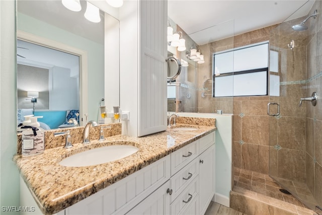 bathroom featuring vanity and a shower with shower door