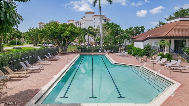 view of swimming pool featuring a patio area