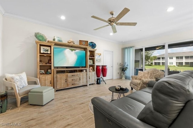 living room with ceiling fan and ornamental molding