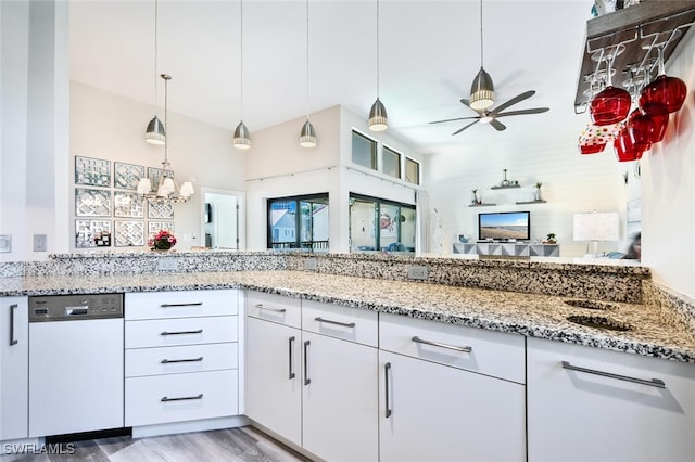 kitchen featuring white cabinetry, dishwasher, hanging light fixtures, hardwood / wood-style flooring, and light stone counters